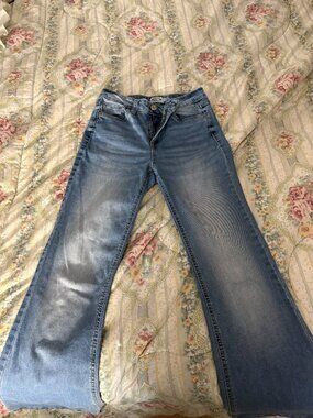 light blue distressed y2k style flare jeans